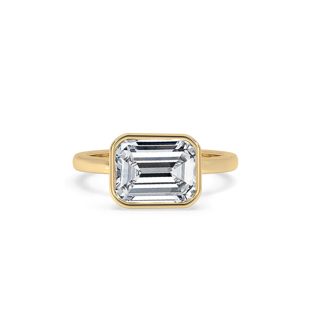 Bezel Emerald Cut Engagement Ring In Yellow Gold