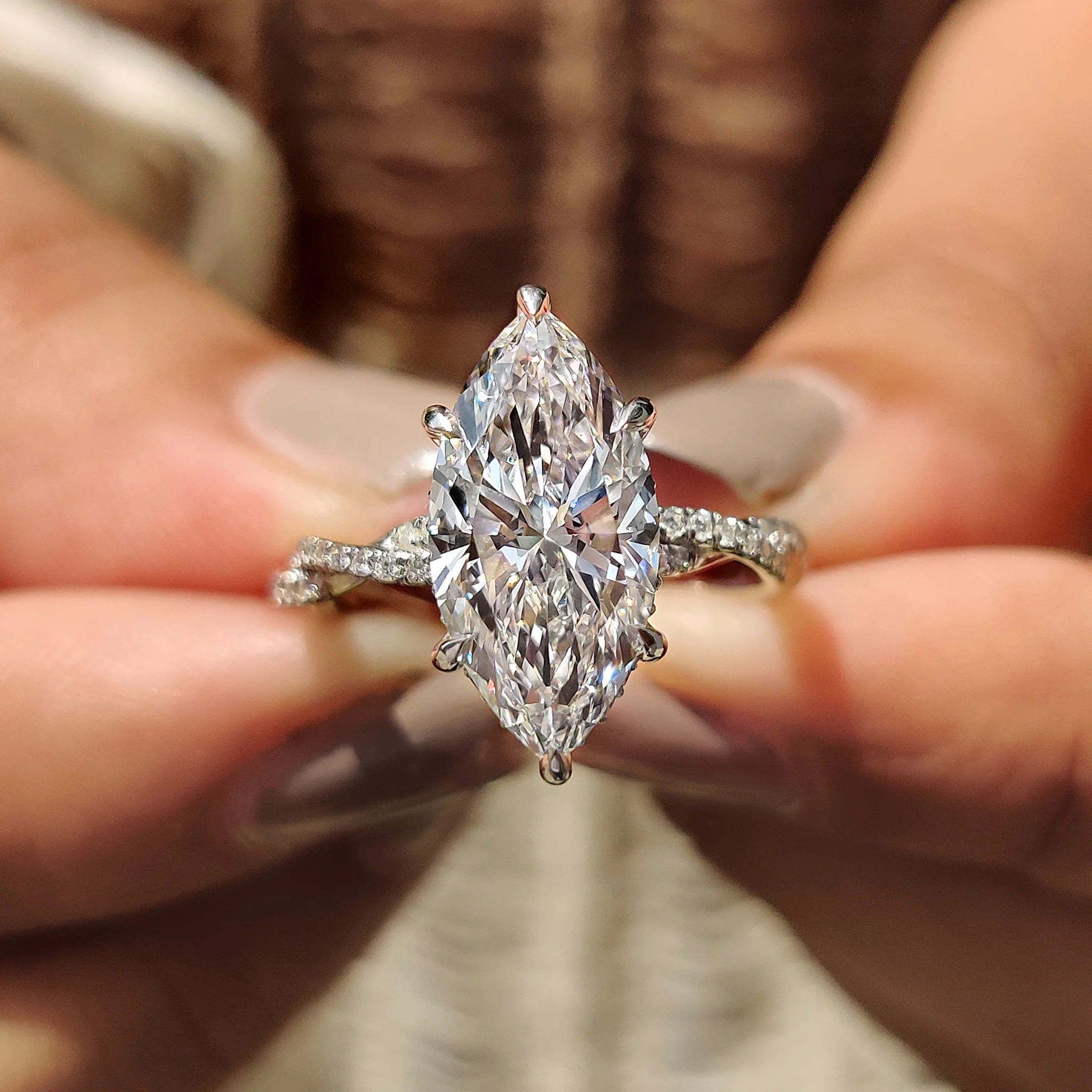 Marquise Cut Engagement Ring With Twisted Pave Band