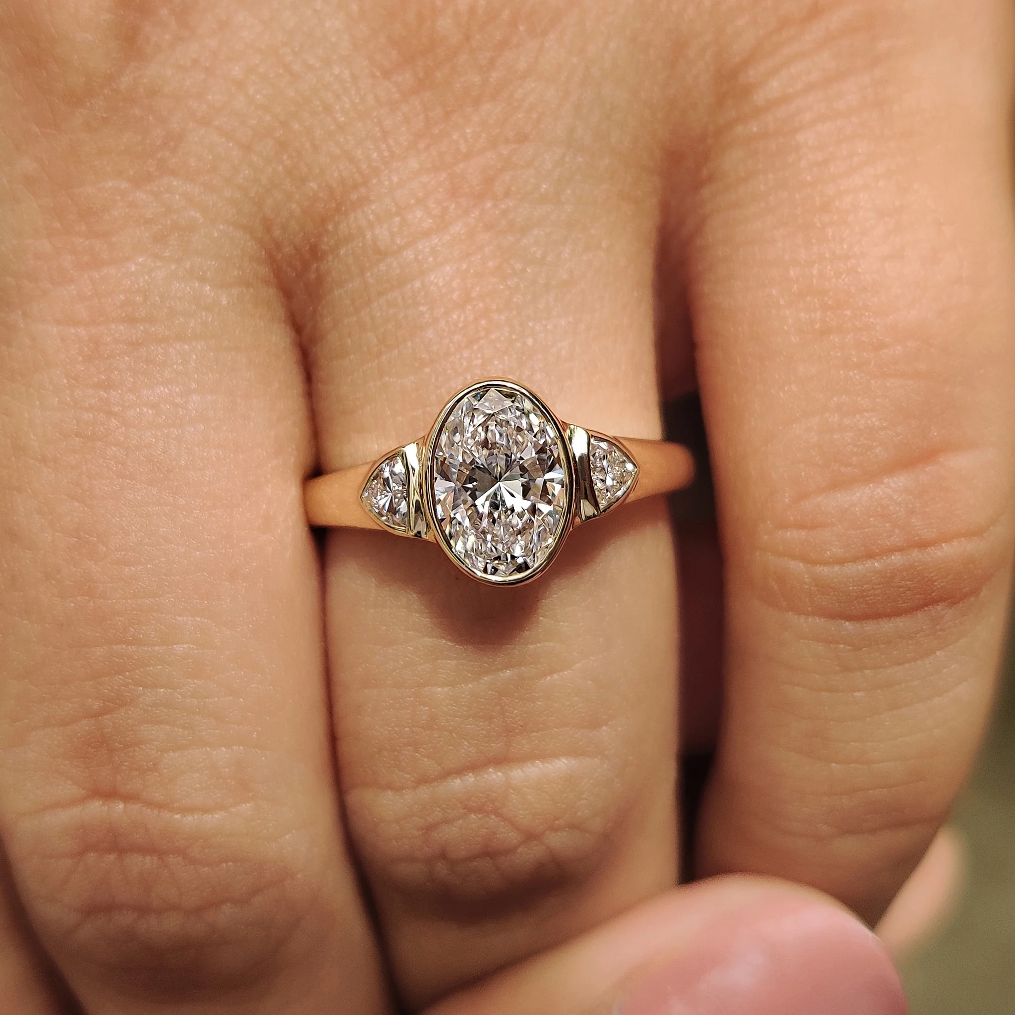 Oval Bezel Engagement Ring With Trillion Side Stone - Image 6