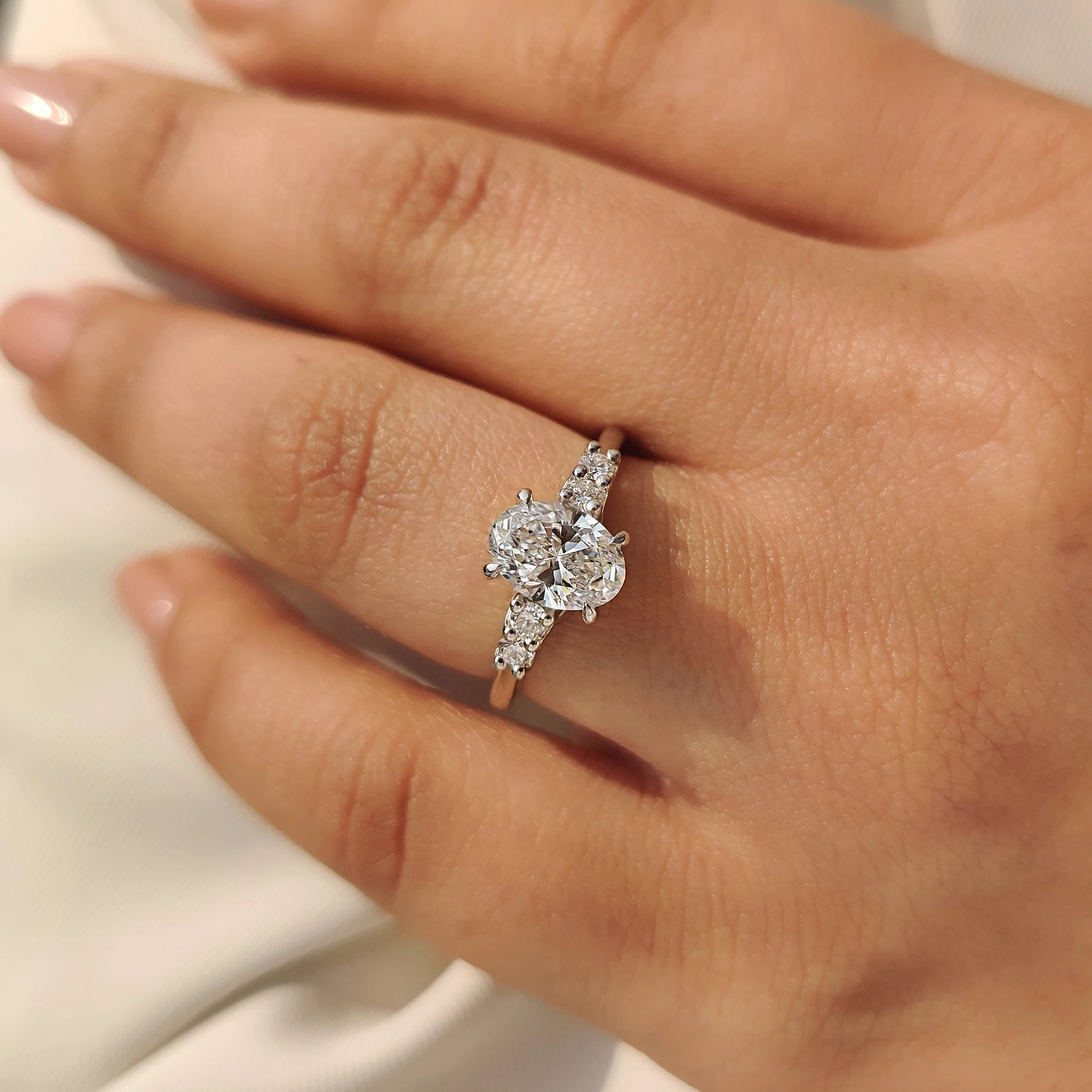 Oval Cut Diamond Ring with Round Side Stones - Image 2