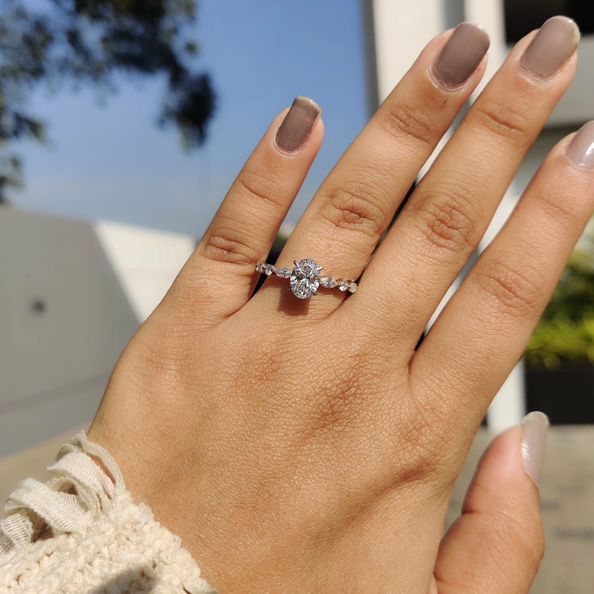 Oval Cut Engagement Ring With Round And Marquise Side Stones - Image 3