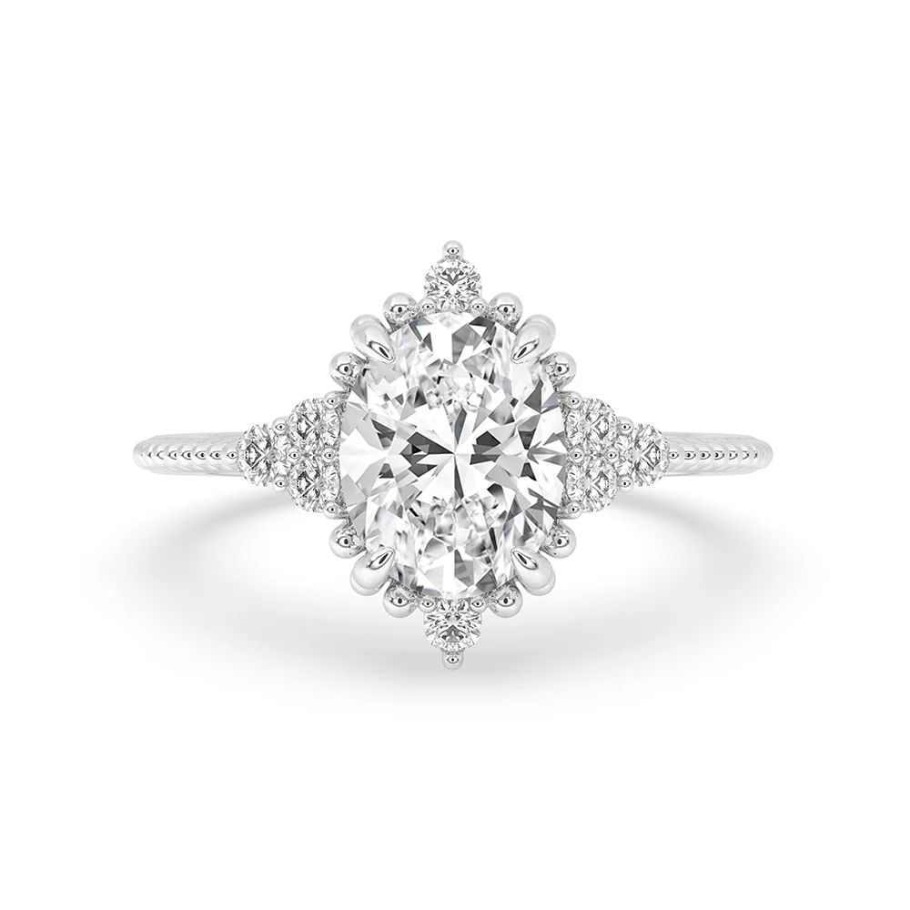 Oval Diamond Ring With Round Side Stone