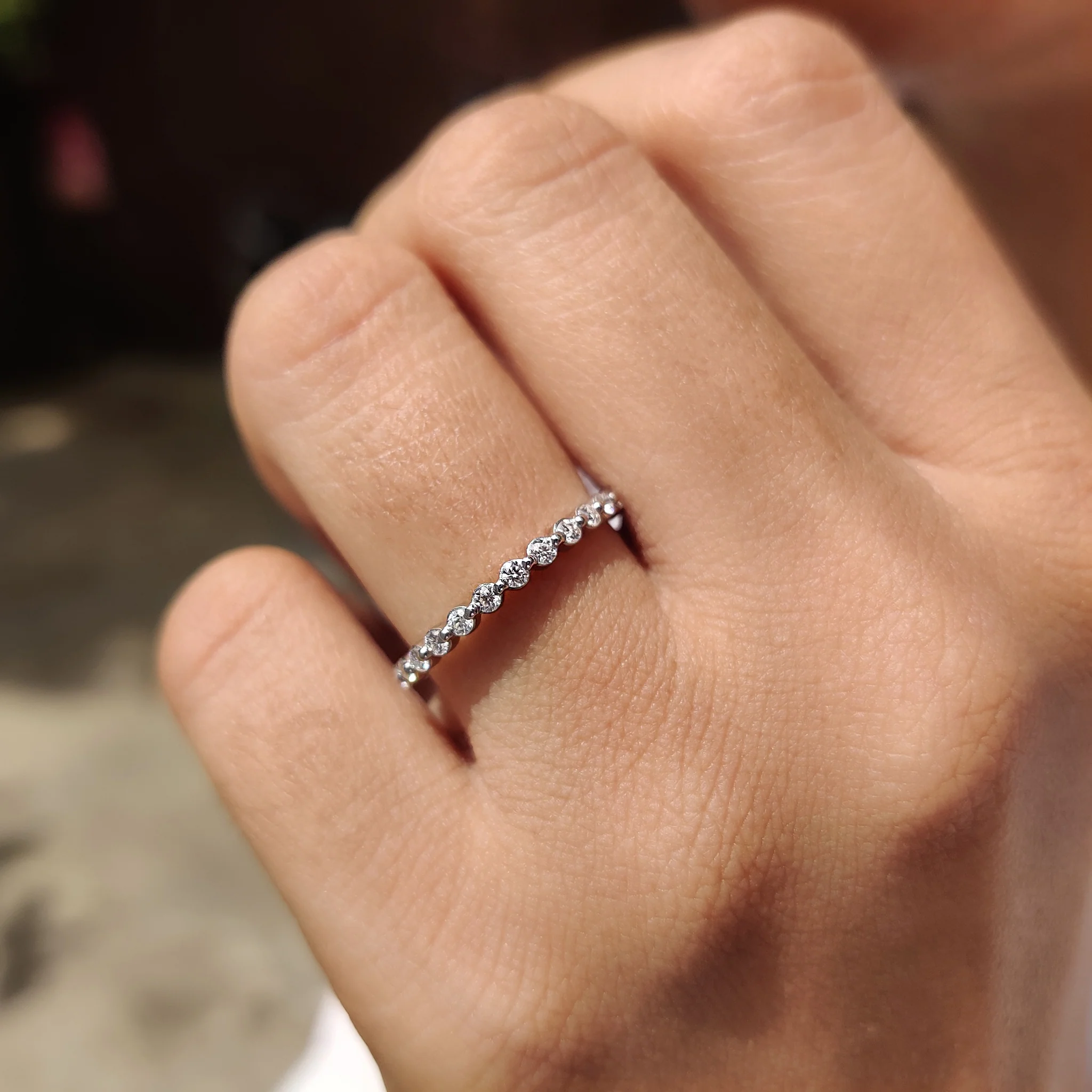 Round Cut Moissanite Shared Prong Wedding Band - Image 6