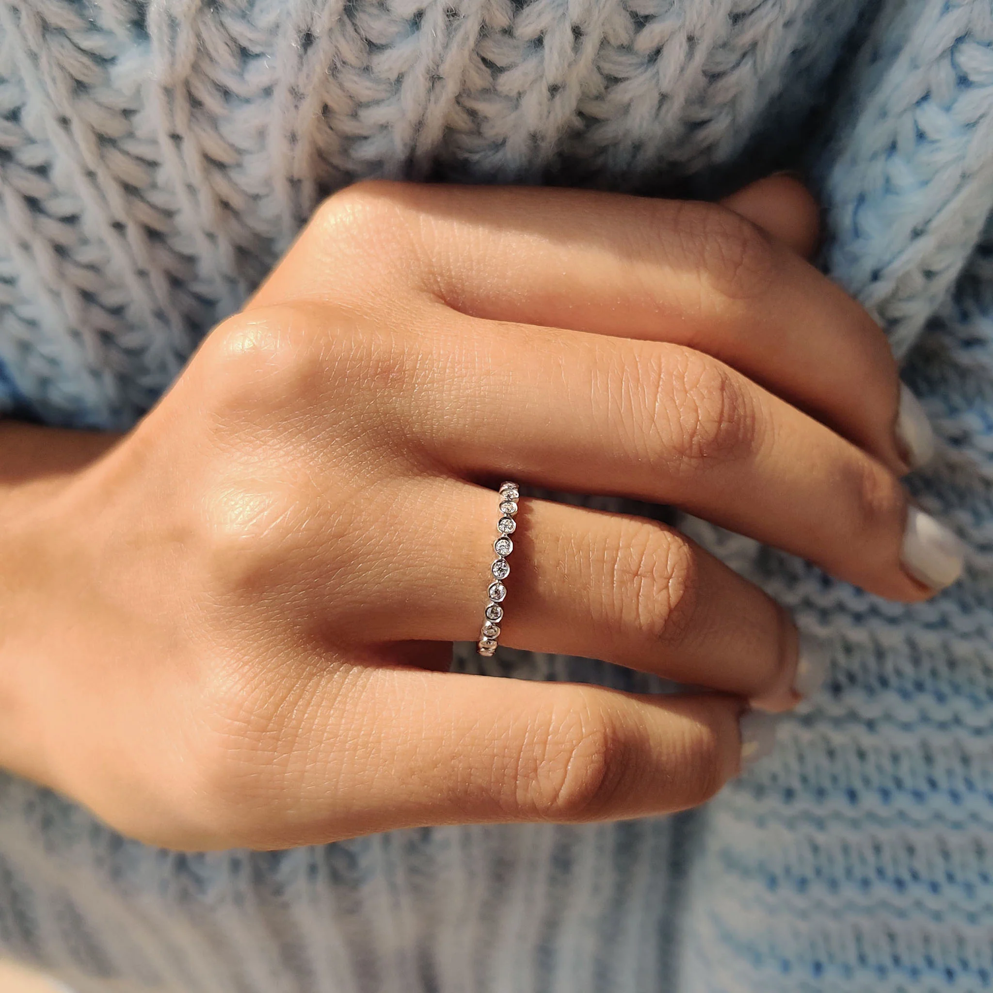 Round Eternity Band In a Smooth Bezel Set Design - Image 9